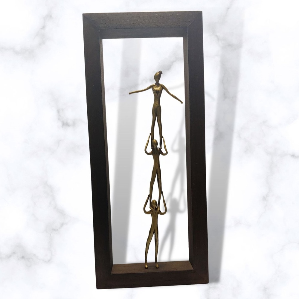 Bronze sculpture in frame 