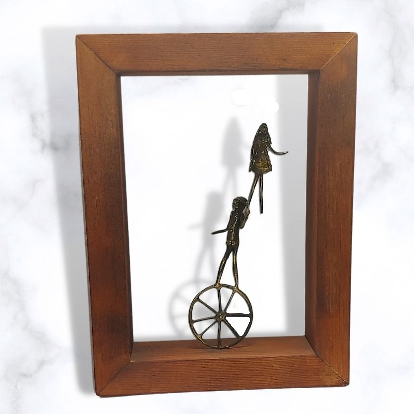 Bronze sculpture in frame 
