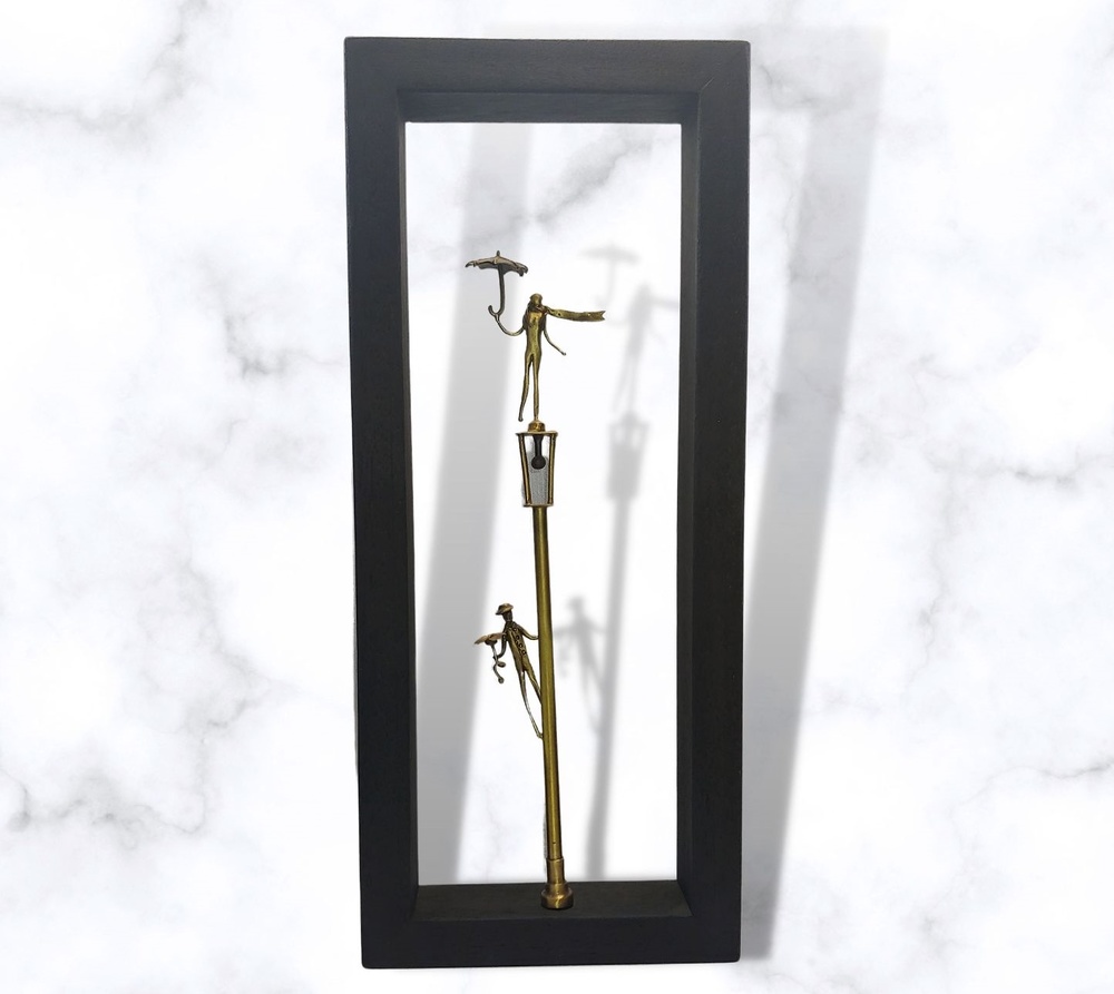 Bronze sculpture in frame 