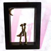 Sonata Gallery - "Kiss under the moon". Bronze figures scene on wood frame.