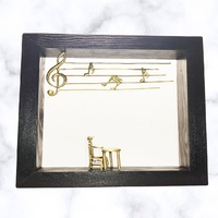 Sonata Gallery - "Piano notes" Bronze figures on wood frame.